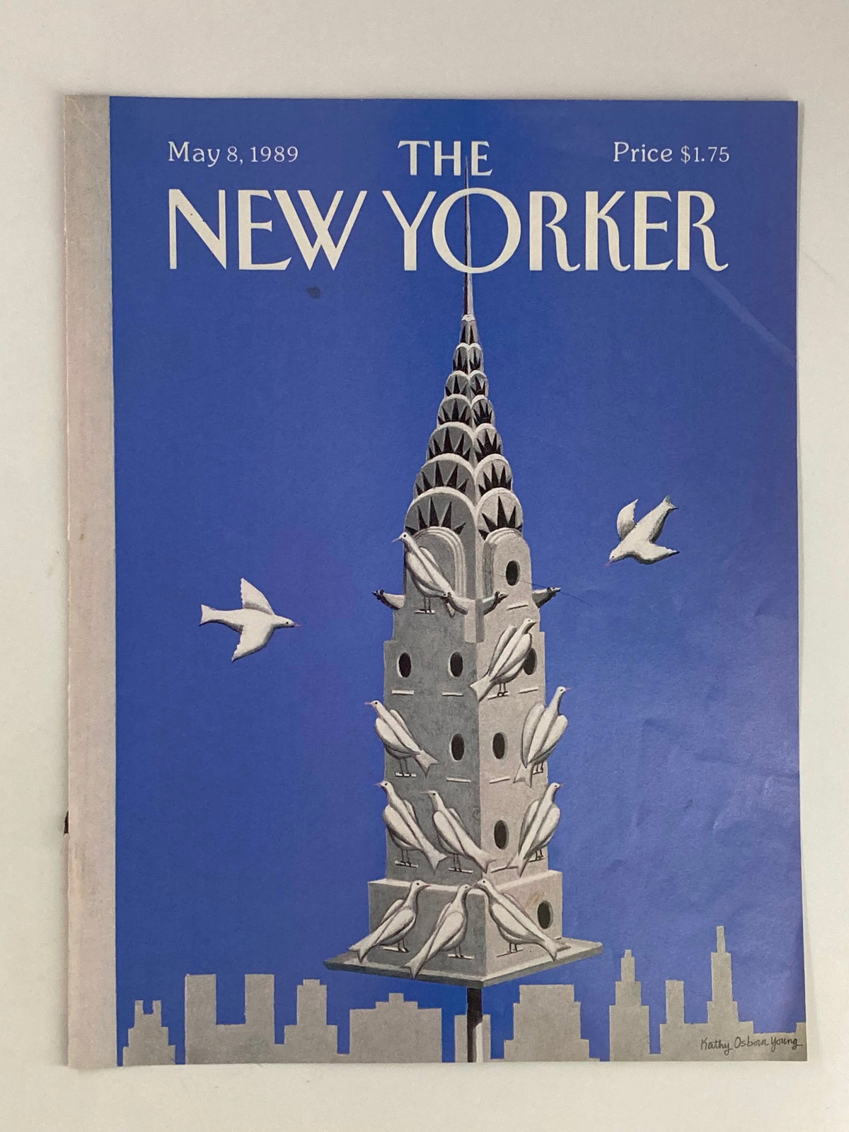 The cover of The New Yorker, May 8, 1989, highlighting a unique birdhouse art by Kathy Osborn Young, set against a vibrant blue canvas with birds in flight.
