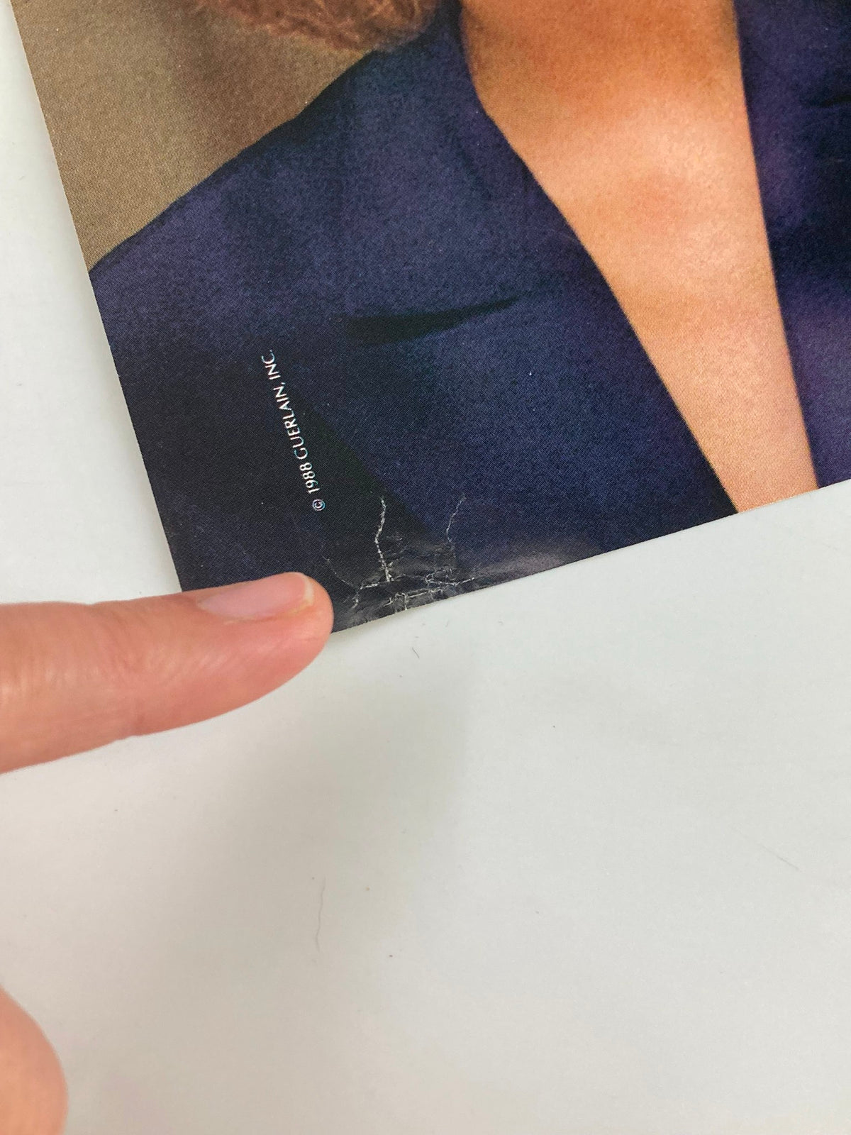 Close-up of a magazine cover corner with visible wear, highlighting the condition of vintage media, not directly related to The New Yorker April 10, 1989 cover.