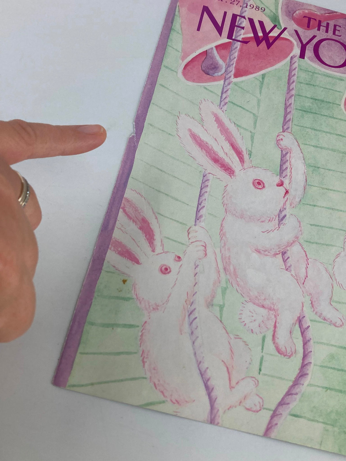 The New Yorker Cover from March 27, 1989 featuring whimsical bunnies by artist Charles Addams, highlighting a small rip on the binding, showcasing vintage charm.