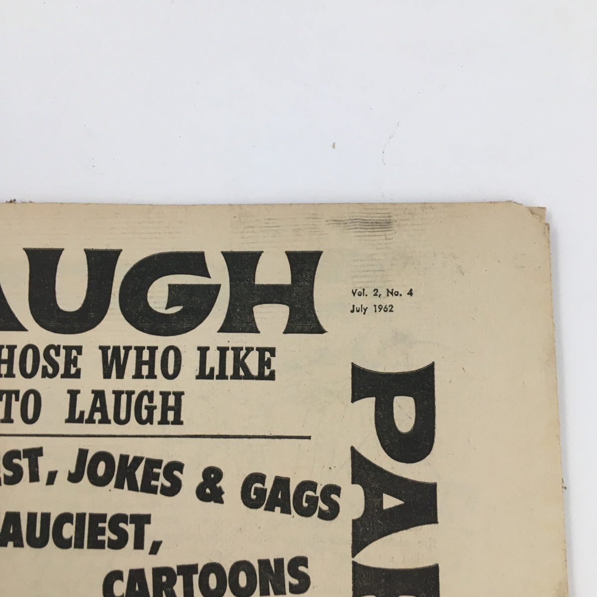 Top section of the Laugh Parade Humor Magazine July 1962 showing volume and issue number, highlighting its vintage design.
