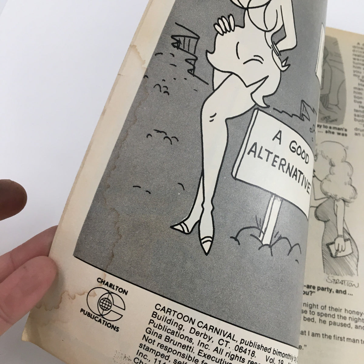 Inner page of Cartoon Carnival Magazine September 1981 showcasing an illustrated advertisement with a playful cartoon character sitting next to a sign that reads 'A Good Alternative'.