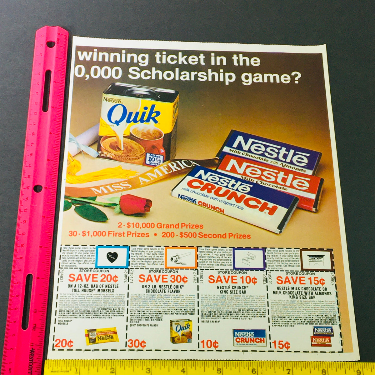VTG Retro 1983 Nestle Quik, Nestle Crunch & Nestle Milk Chocolate Ad Coupon highlighting promotional offers with a ruler for size reference, in great shape.