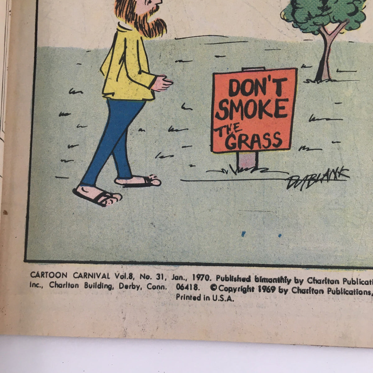 Interior page of Cartoon Carnival Magazine January 1970 showing a cartoon character walking by a sign that reads 'DON'T SMOKE THE GRASS,' reflecting the humorous cultural themes of the era.
