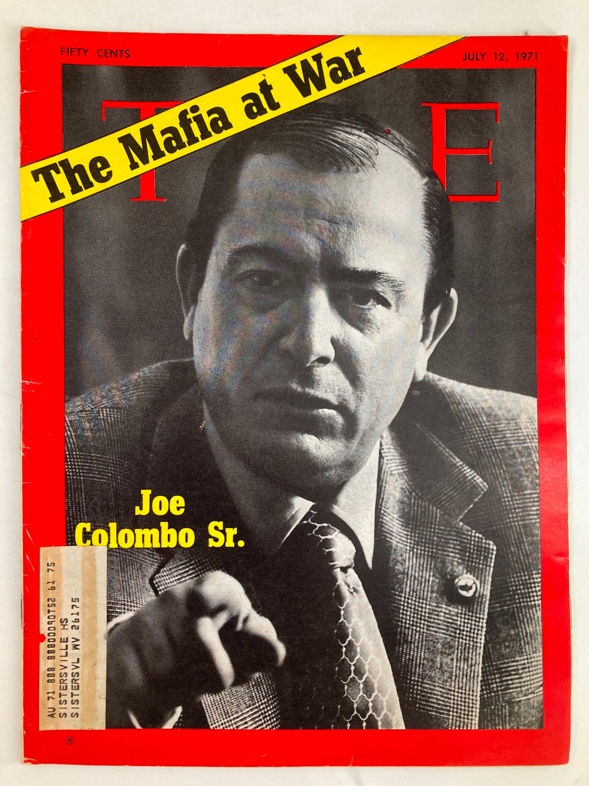 Vintage Time Magazine cover from July 12, 1971, featuring Joe Colombo Sr. with the headline 'The Mafia at War.' The cover showcases Colombo in a suit, emphasizing his significance in organized crime history and the captivating article within.