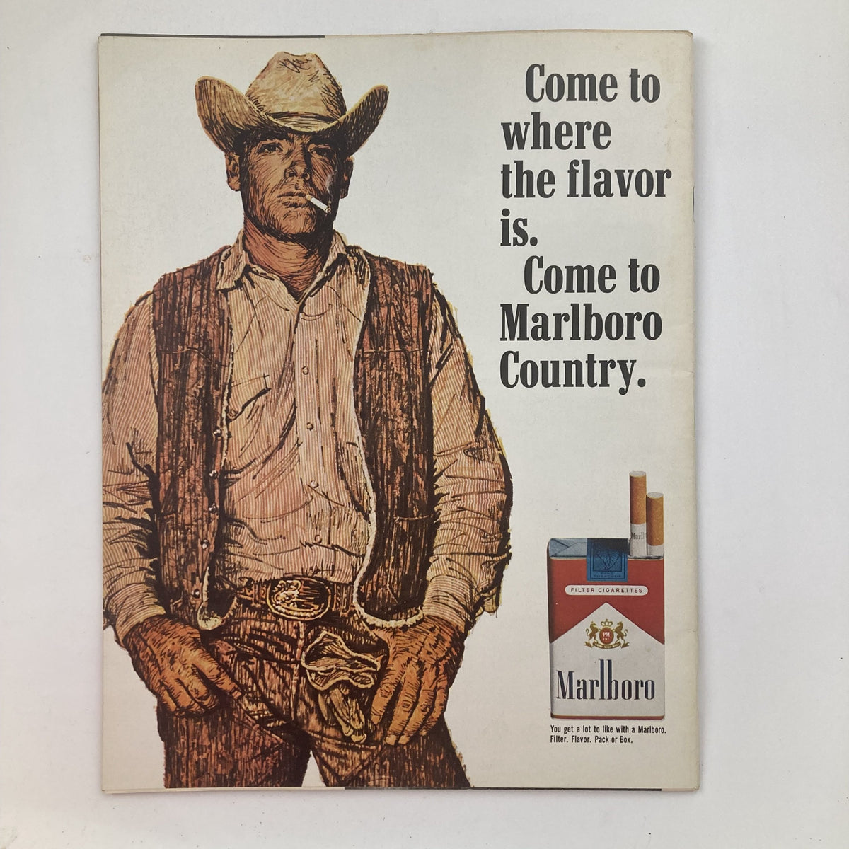 Vintage advertisement in Life Magazine February 20, 1970 edition featuring a cowboy promoting Marlboro cigarettes with the slogan 'Come to where the flavor is. Come to Marlboro Country.'