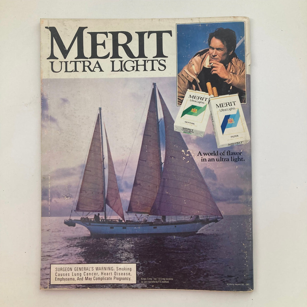 Cover of Merit Ultra Lights magazine showcasing a sailing scene with a man and Merit cigarette ads, highlighting themes of lifestyle and smoking.