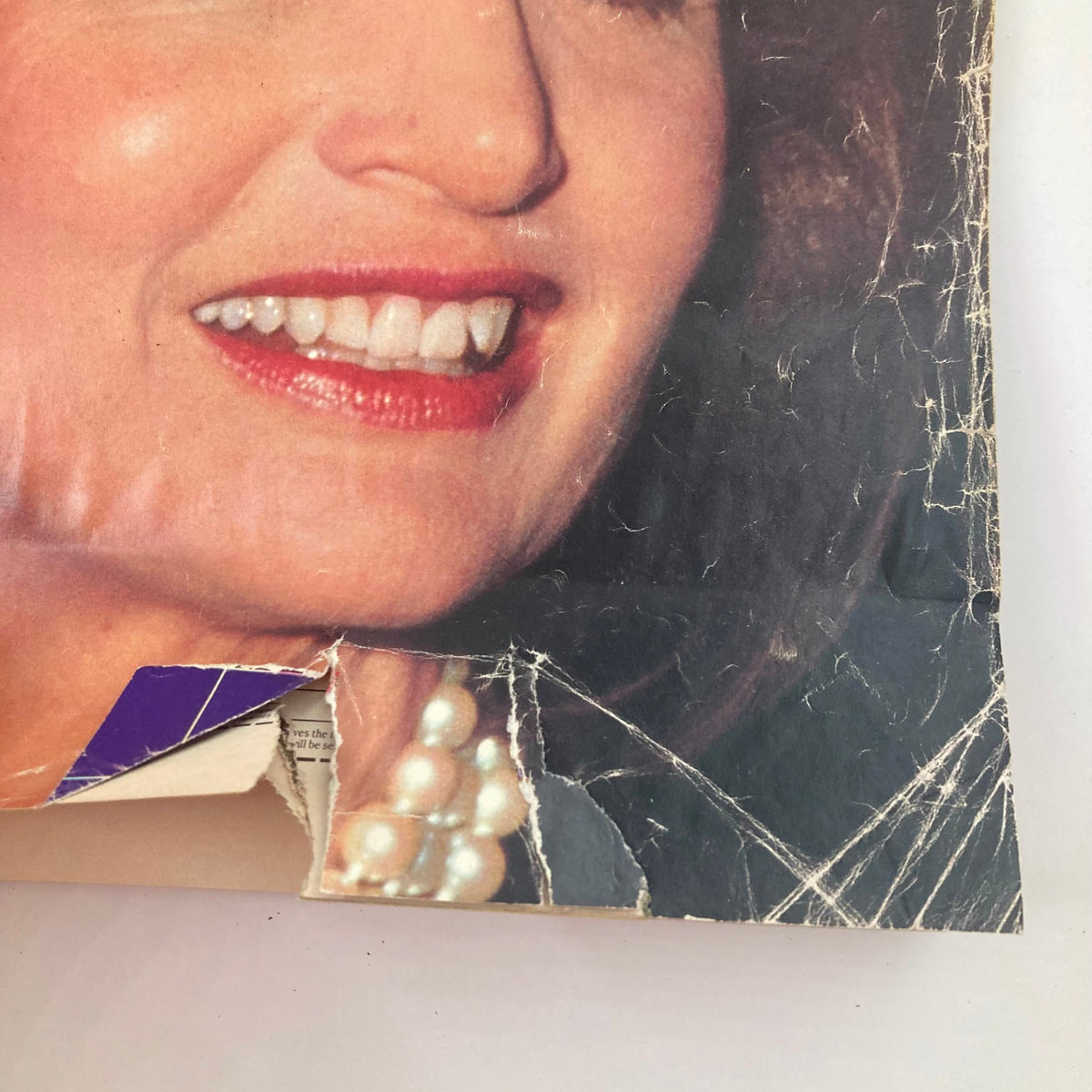 Close-up detail of VTG Life Magazine July 1989 cover, highlighting Jackie Onassis's face, expressive smile, and pearl necklace.