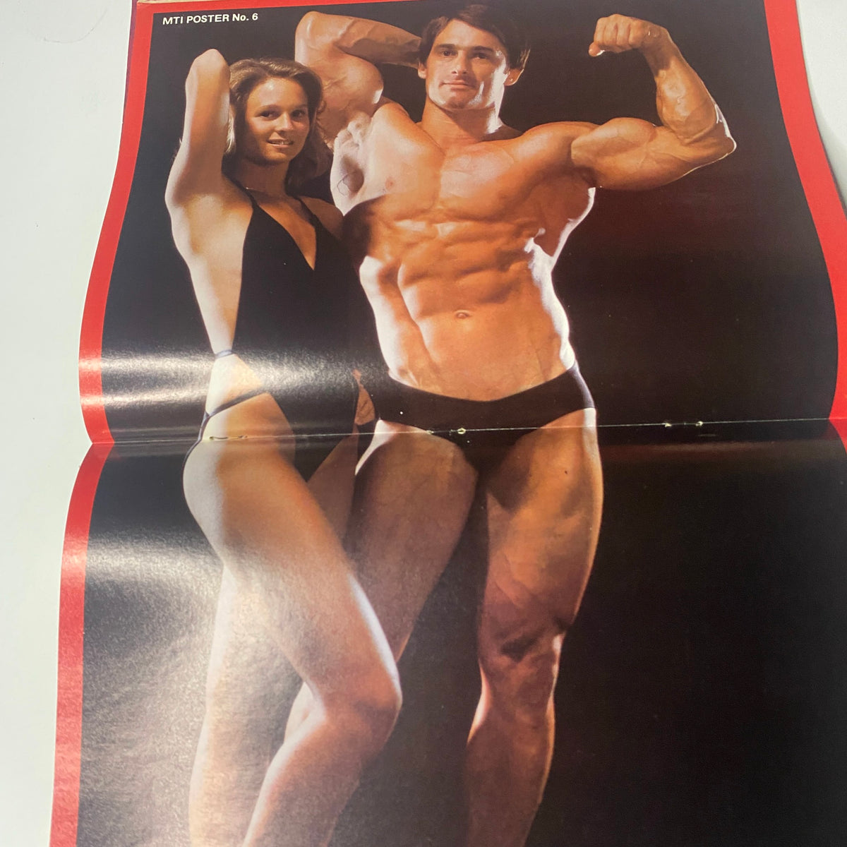 Centerfold from Muscle Training Illustrated March 1979 showcasing a muscular male bodybuilder and a female model posing together, emphasizing fitness and bodybuilding aesthetics.