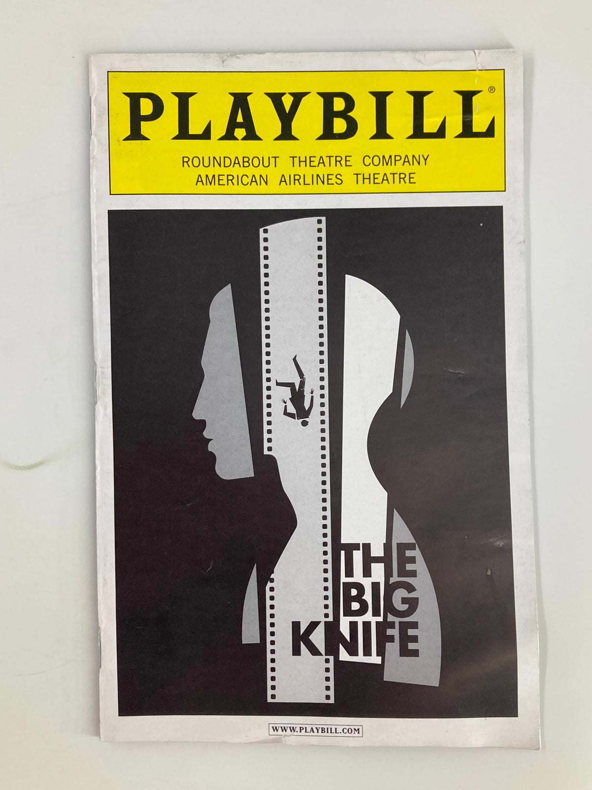 2013 Playbill for The Big Knife by Clifford Odets showcasing striking cover art in black and yellow, representing the famous production at Roundabout Theatre Company, American Airlines Theatre.