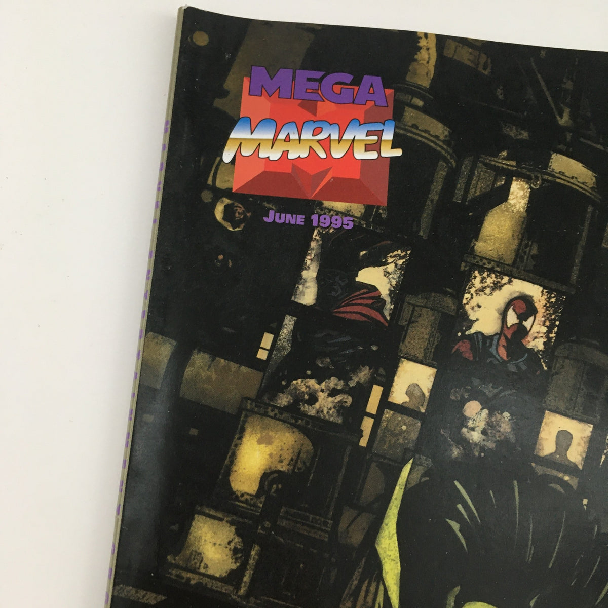 Close-up of Mega Marvel Comics June 1995 logo, highlighting Spider-Man and the publication's vintage appeal.