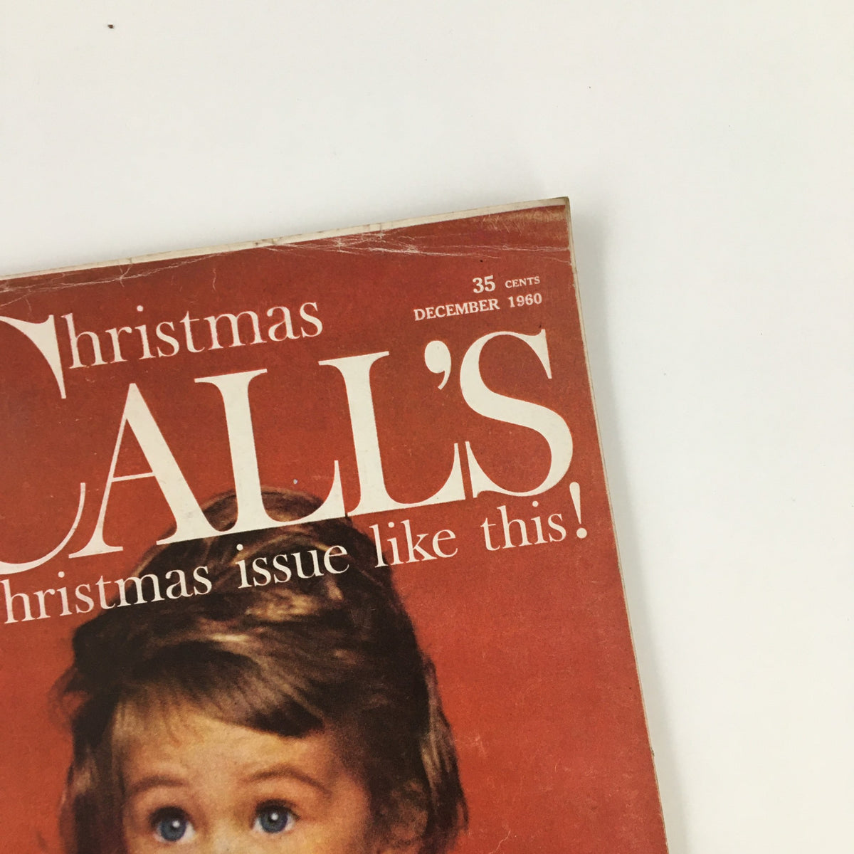 Top view of McCall's Magazine December 1960, highlighting the date and festive message on the cover.