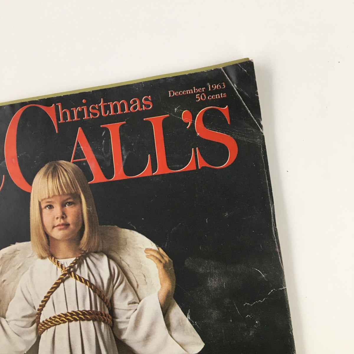 Front cover of McCall's Magazine December 1963, showcasing a young girl dressed as an angel with a festive title highlighting the Christmas edition.