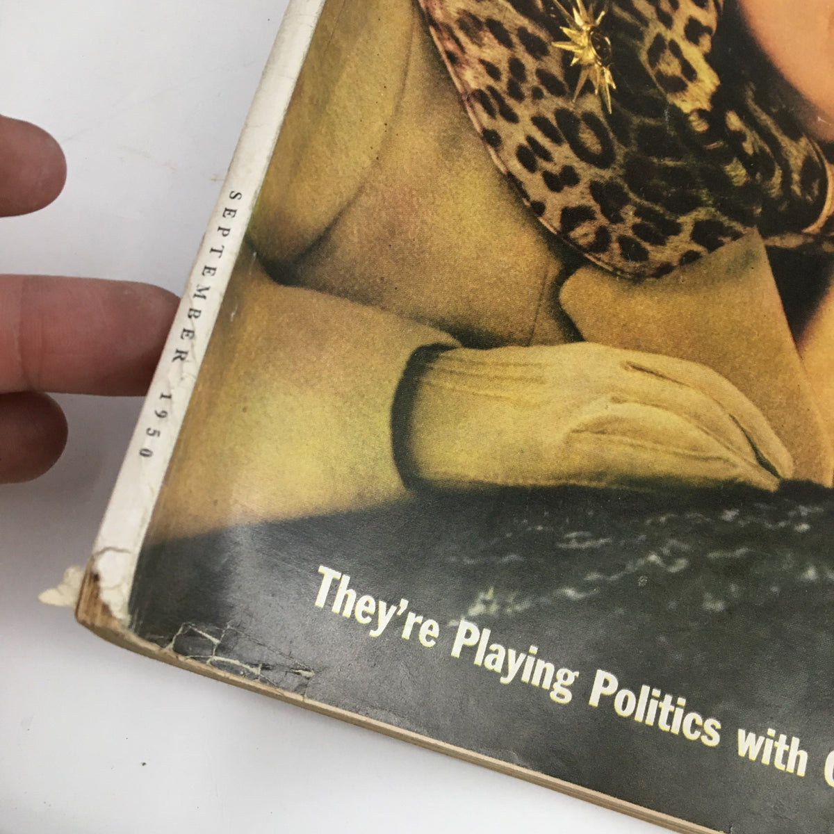 Close-up of McCall's Magazine September 1950 showing a woman's hand on the cover, the title 'They're Playing Politics with Our Children' is visible.