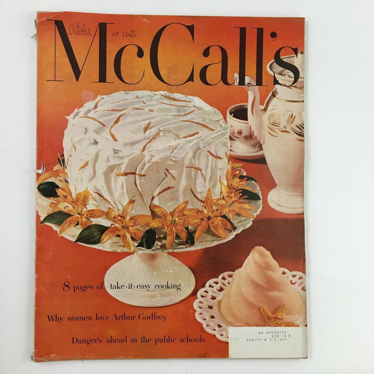 Cover of McCall's Magazine October 1952 featuring a cake with vibrant decorations and the title prominently displayed, showcasing vintage fashion and cooking content.