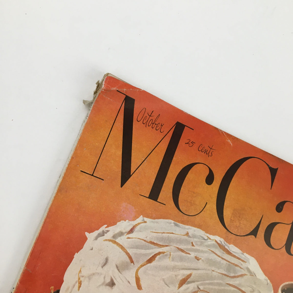 Close-up of the title and date on the cover of McCall's Magazine October 1952, highlighting the vintage aesthetic and historical context.