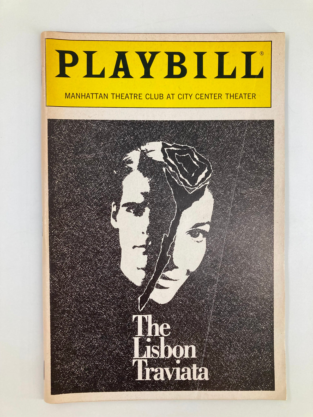 Front cover of the 1989 Playbill for 'The Lisbon Traviata' by Terence McNally, featuring a black and white artistic illustration of two faces and a rose.