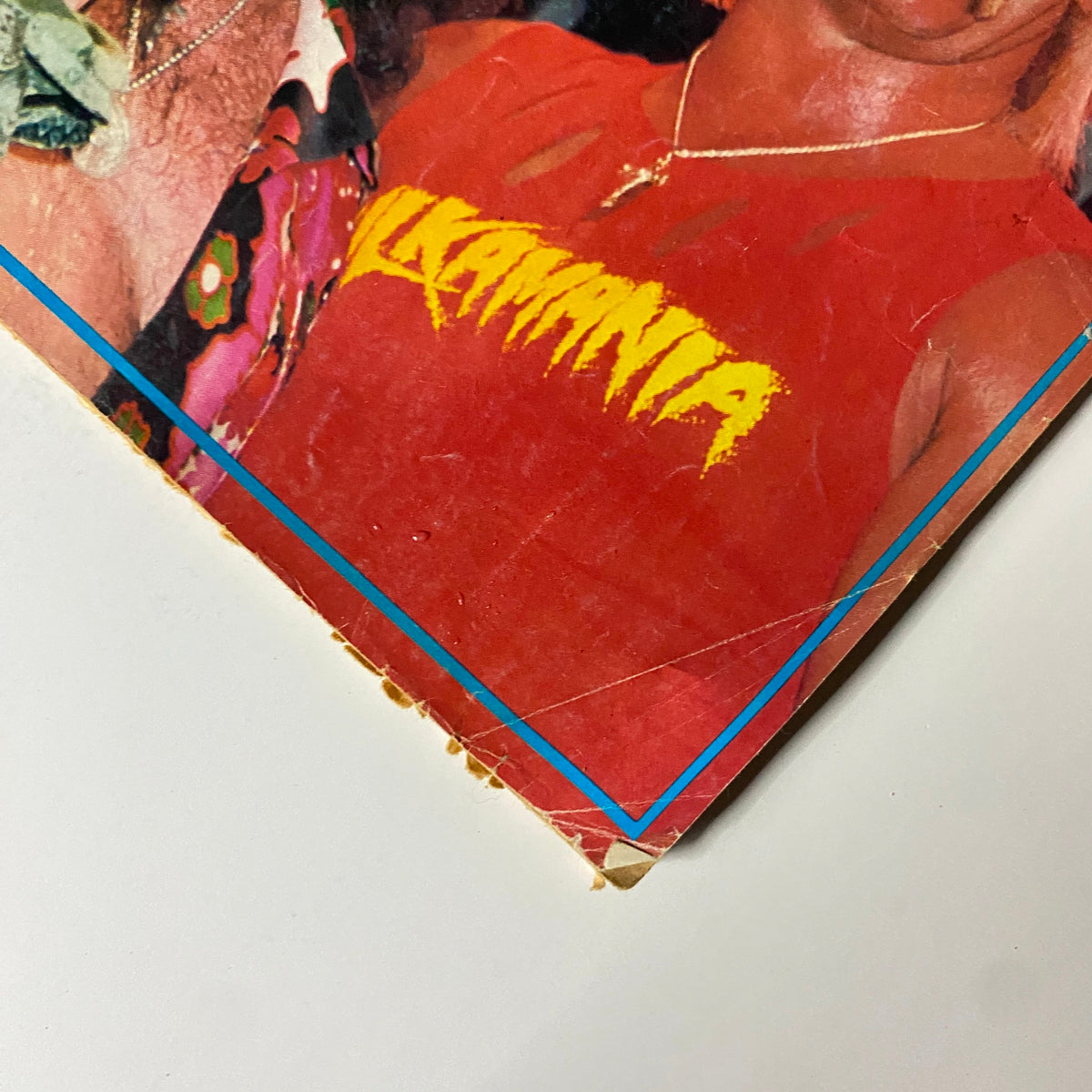 Close-up of Hulk Hogan in Inside Wrestling Magazine April 1985 wearing a 'HULKAMANIA' shirt, showcasing the iconic wrestling culture.