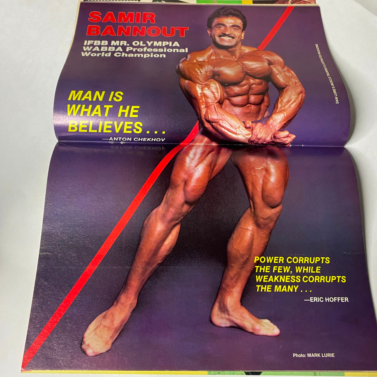 Centerfold of Muscle Training Illustrated October 1986, featuring Samir Bannout, IFBB Mr. Olympia, showcasing his physique with a motivational quote.