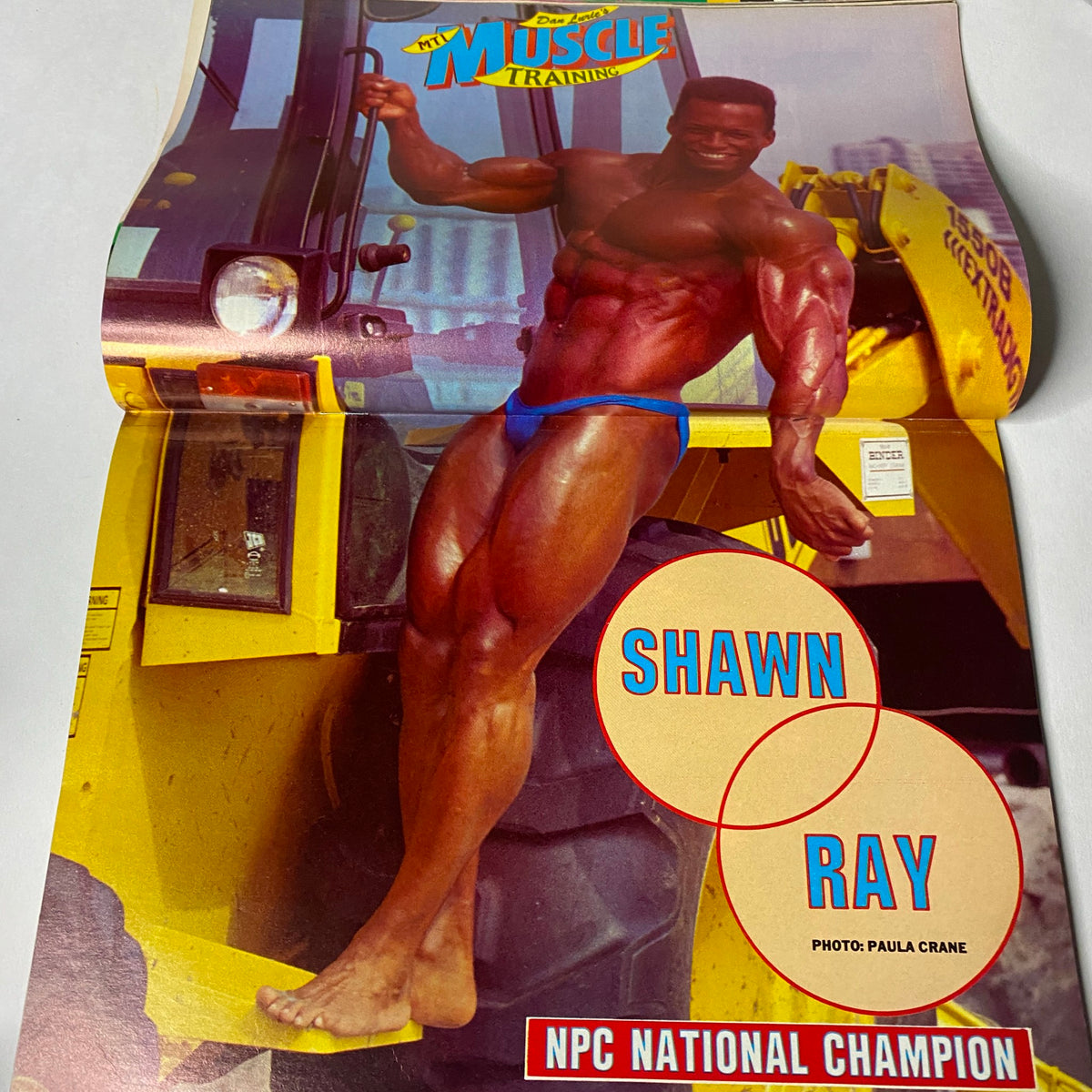 Centerfold from Muscle Training Illustrated April 1988 featuring Shawn Ray, NPC National Champion, showcasing a muscular physique and striking pose. Image captures the essence of bodybuilding excellence in the late 1980s.