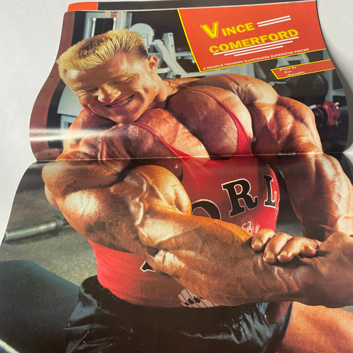 Muscle Training Illustrated June 1990 centerfold of Vince Comerford displaying muscular physique in a fitness training pose.
