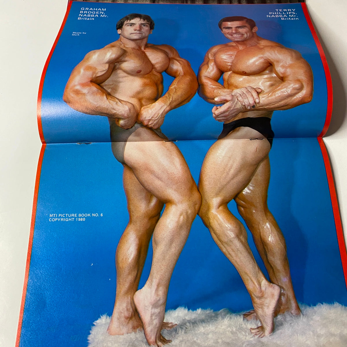 Muscle Training Illustrated Picture Book & Pen Pals Summer 1980 centerfold image of athletes Graham Brogen and Terry Phillips showcasing bodybuilding poses.