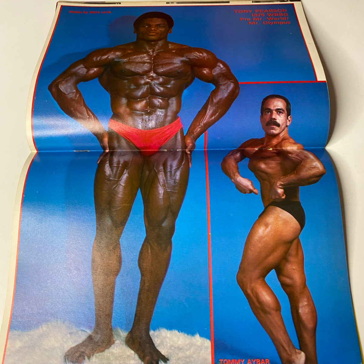 Muscle Training Illustrated March 1980 featuring Tommy Aybar and Tony Pearson posing in bodybuilding competition attire, showcasing their physique. This image is part of Issue No. 82, highlighting prominent figures in the bodybuilding scene.