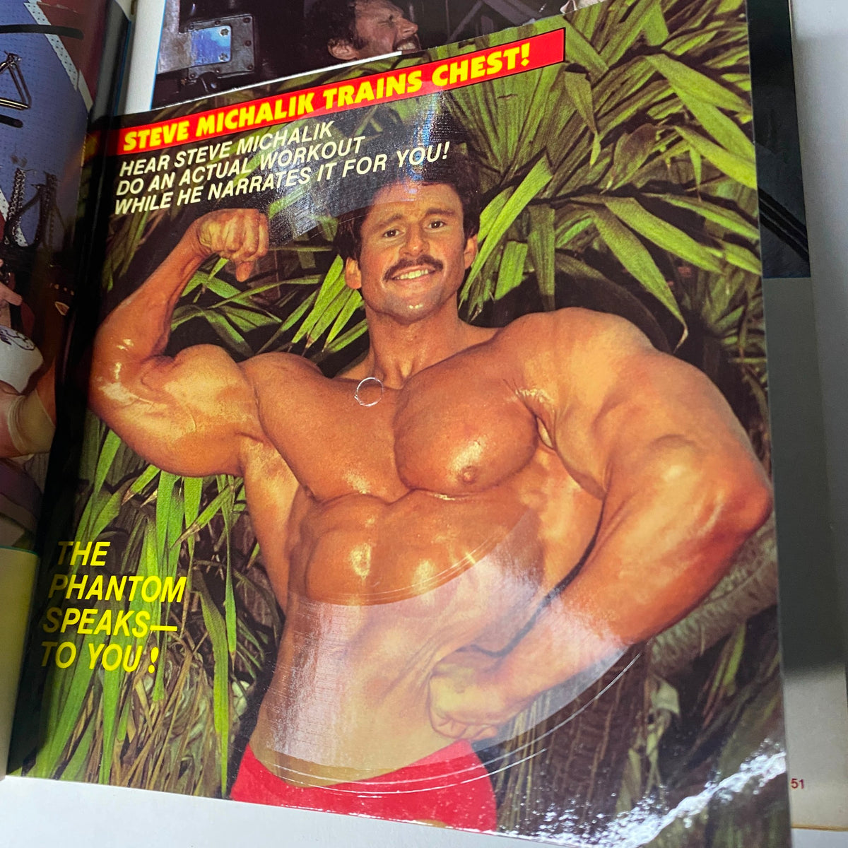 Steve Michalik showcasing his physique in an article titled 'Steve Michalik Trains Chest!' from Muscle Training Illustrated October 1983.