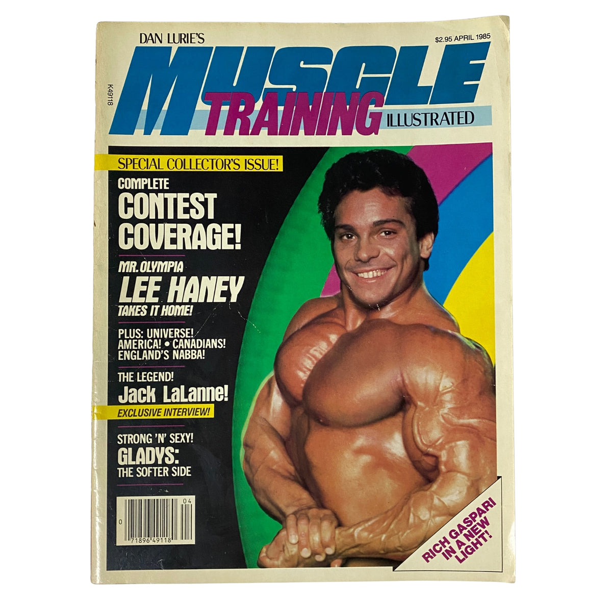 Cover of Muscle Training Illustrated, April 1985, No. 122 featuring Rich Gaspari, showcasing special contest coverage and highlighting Lee Haney's Mr. Olympia victory.