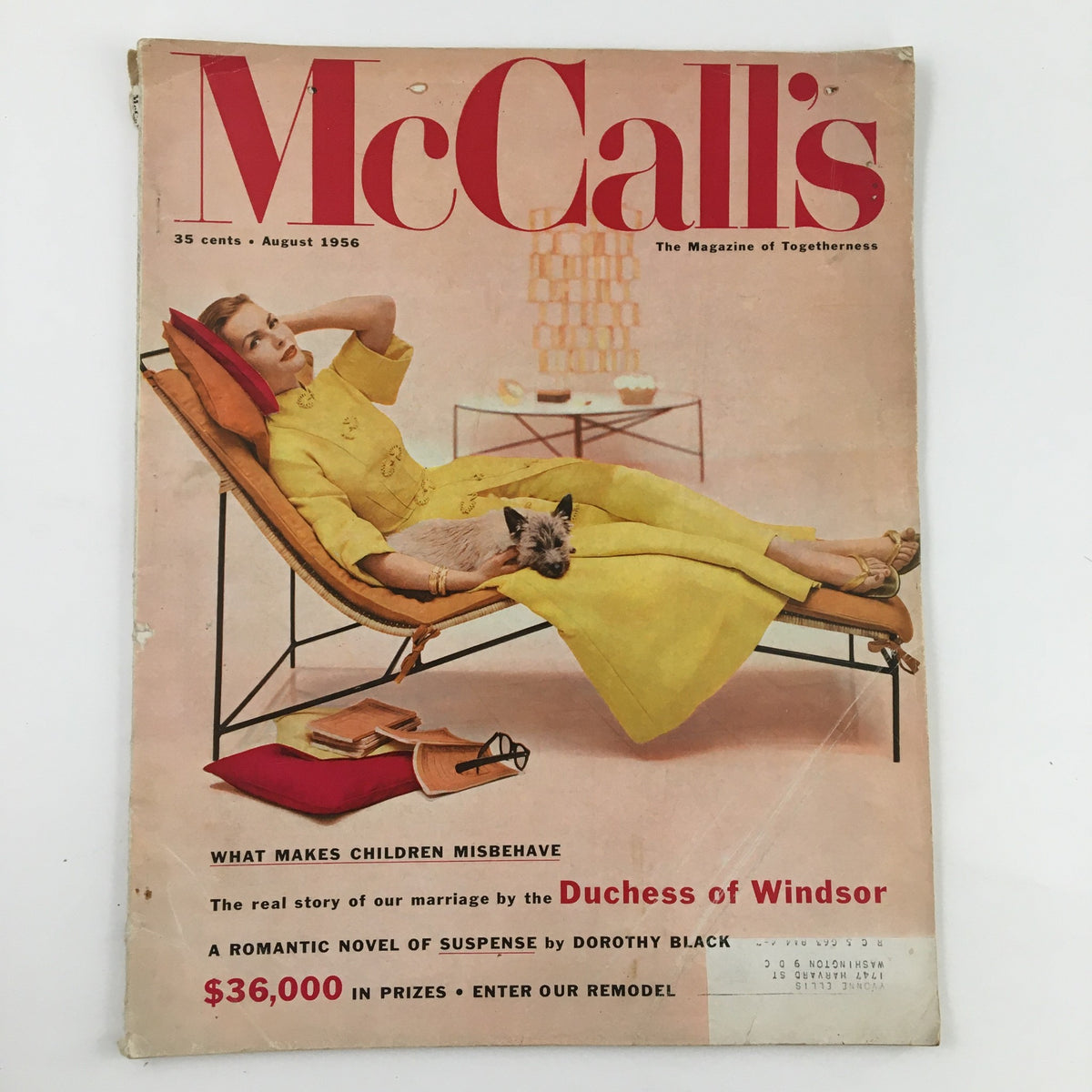 Cover of McCall's Magazine August 1956 featuring the Duchess of Windsor's marriage story, showcasing a vintage aesthetic with a woman in a yellow dress lounging with a cat.