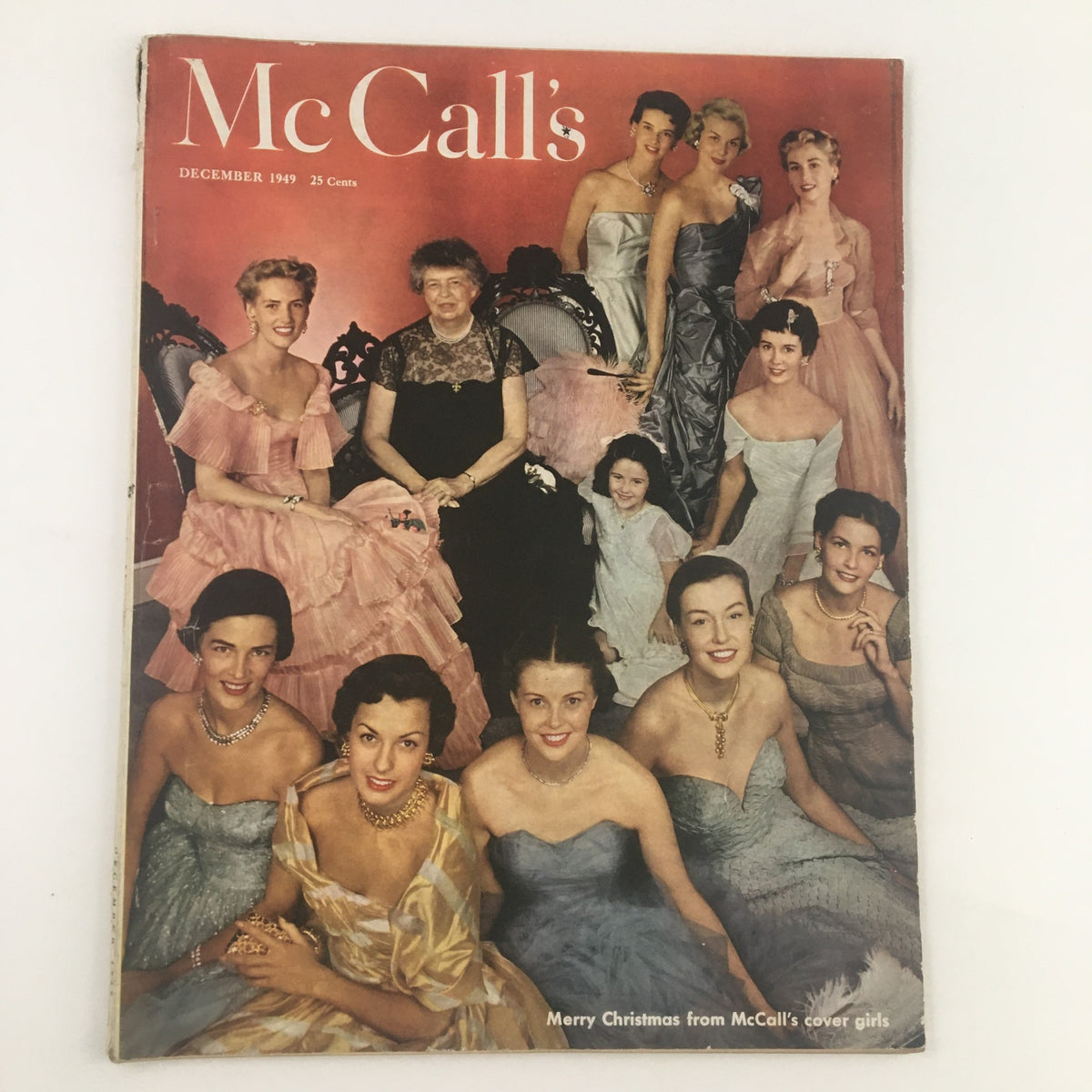 Cover of McCall's Magazine December 1949 titled 'Merry Christmas From The Cover Girls', featuring a group of elegantly dressed women in vintage attire.