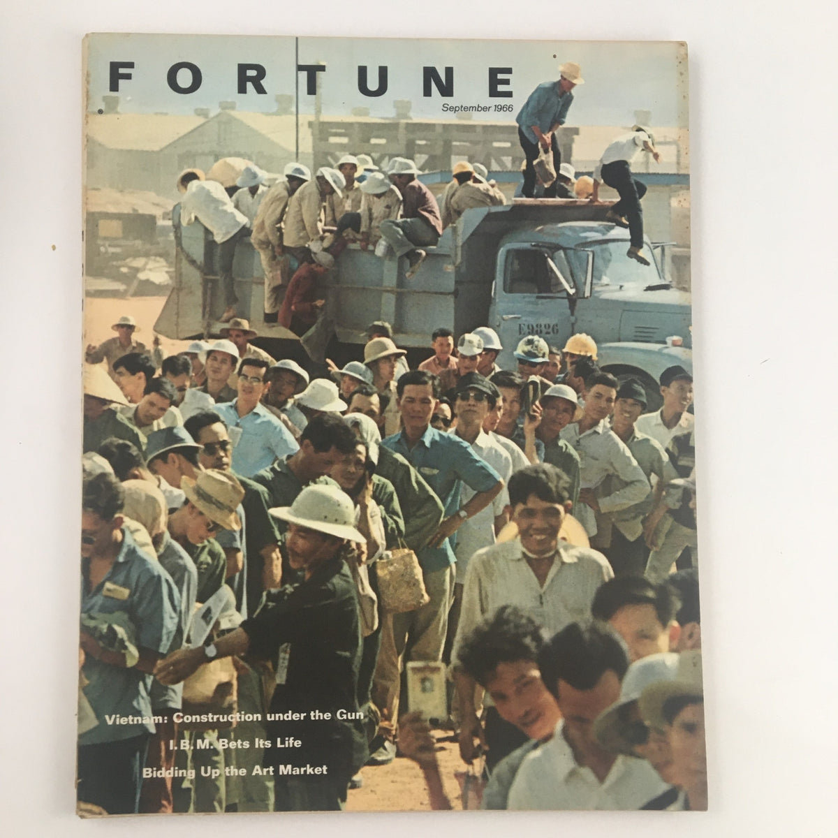 Cover of Fortune Magazine September 1966 featuring a crowd of workers during the Vietnam War era, with the title 'Vietnam: Construction under the Gun' prominently displayed.