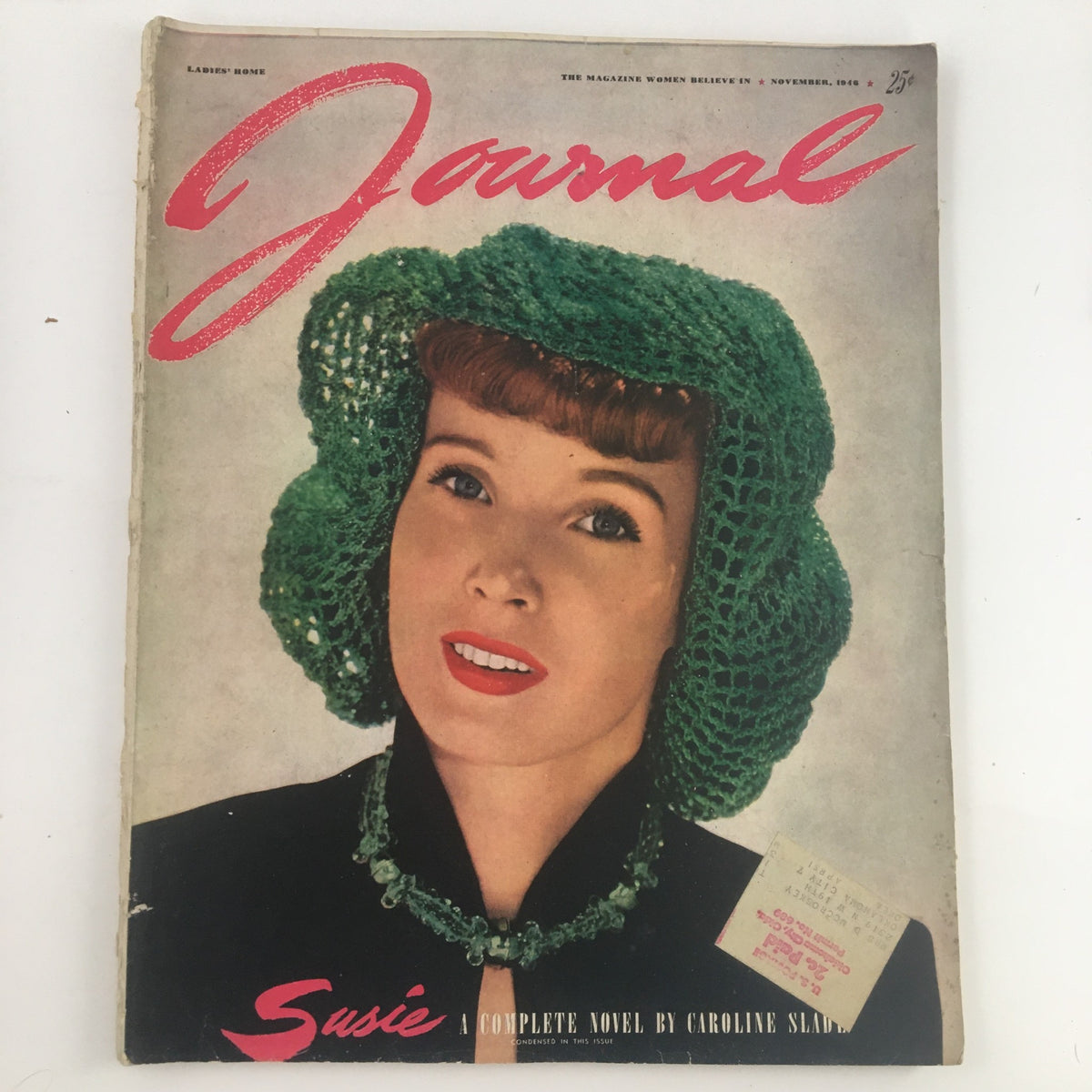Cover of the Ladies' Home Journal Magazine November 1946 featuring the complete novel "Susie" by Caroline S., showcasing a woman in a green hat and vintage attire.
