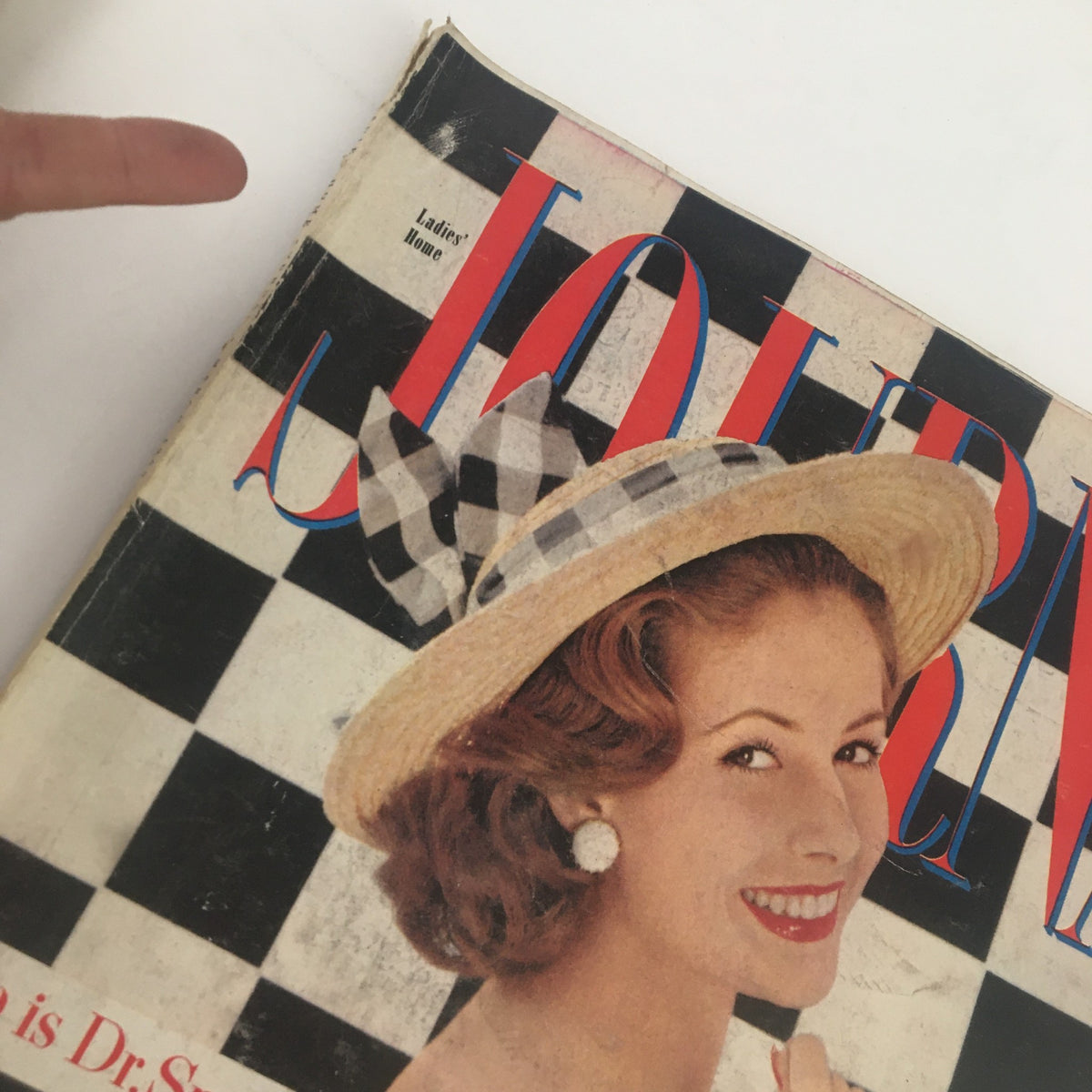 Close-up of the Ladies' Home Journal Magazine March 1960 cover, showcasing a woman with a checkered hat and dress, and the title focused on teenage secret marriages.