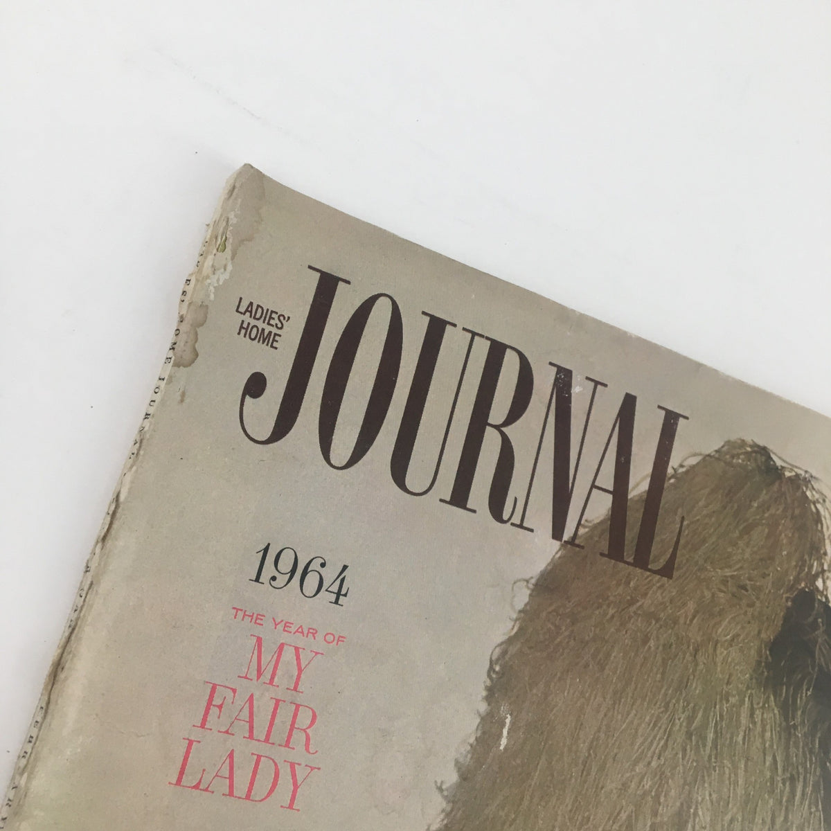 Close-up view of the title and year on the cover of Ladies' Home Journal Magazine January 1964, highlighting 'The Year of My Fair Lady' and the magazine's name.