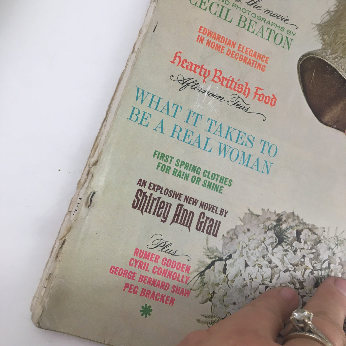Detailed view of the cover text on Ladies' Home Journal Magazine January 1964, focusing on features like 'What It Takes To Be A Real Woman' and cultural highlights from the issue.