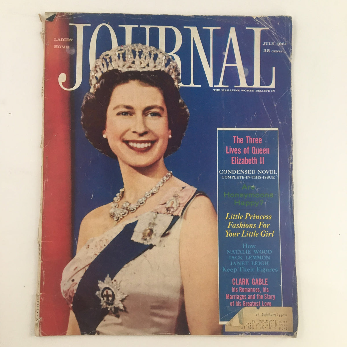 Cover of the Ladies' Home Journal Magazine July 1961 featuring Queen Elizabeth II, showcasing the article 'The Three Lives of Queen Elizabeth II' and vintage magazine design.