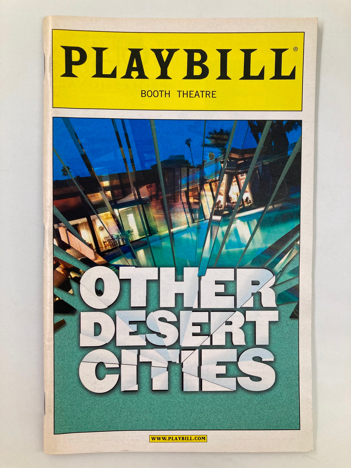 2012 Playbill for 'Other Desert Cities' at Booth Theatre featuring a striking cover design with vibrant colors and bold lettering. This collectible magazine highlights performances by Stockard Channing and Justin Kirk.