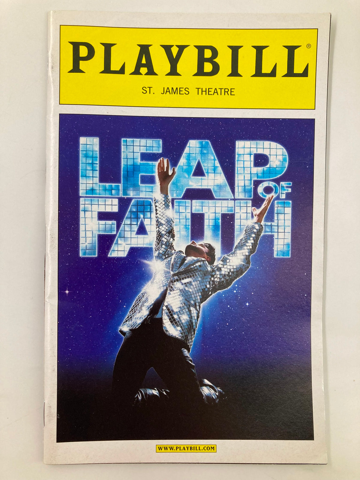 2012 Playbill for Leap of Faith at St. James Theatre featuring vibrant artwork and performance theme.
