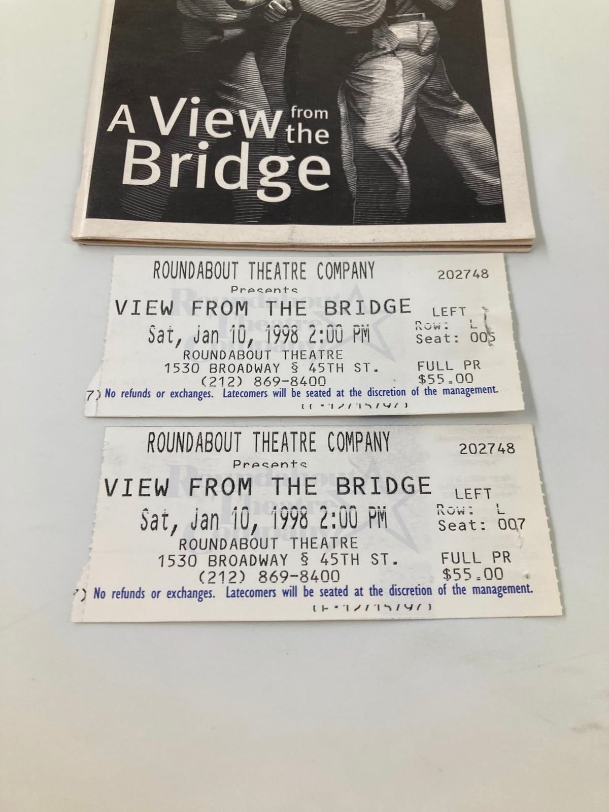 Close-up view of the 1998 Playbill for 'A View from the Bridge' displaying the play's title with two attached ticket stubs showing performance details.