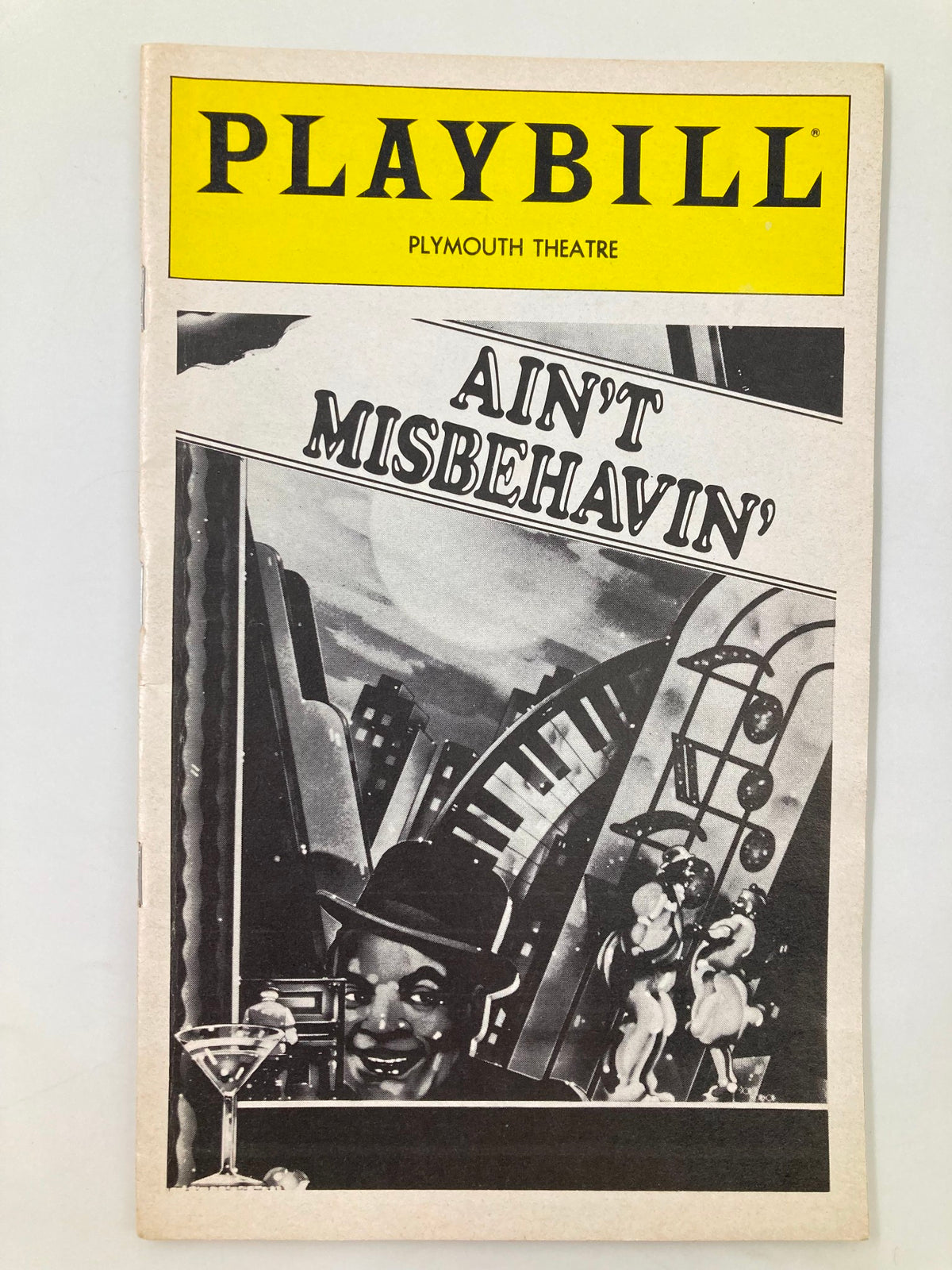 1980 Playbill from Plymouth Theatre featuring 'Ain't Misbehavin' with iconic cover art depicting performers and vibrant musical elements.