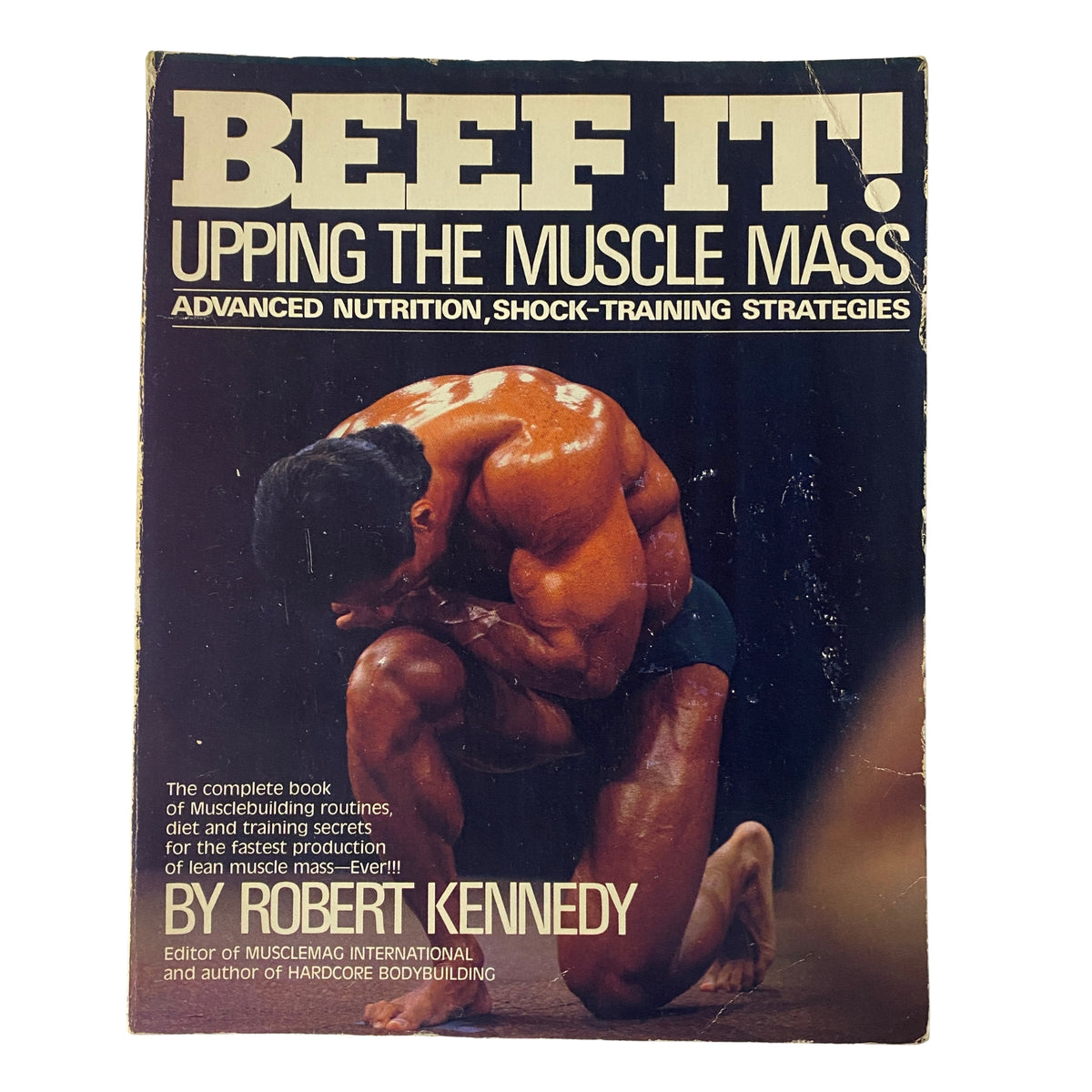 Cover of 'Beef It! Upping The Muscle Mass' book by Robert Kennedy featuring a muscular man in a bodybuilding pose