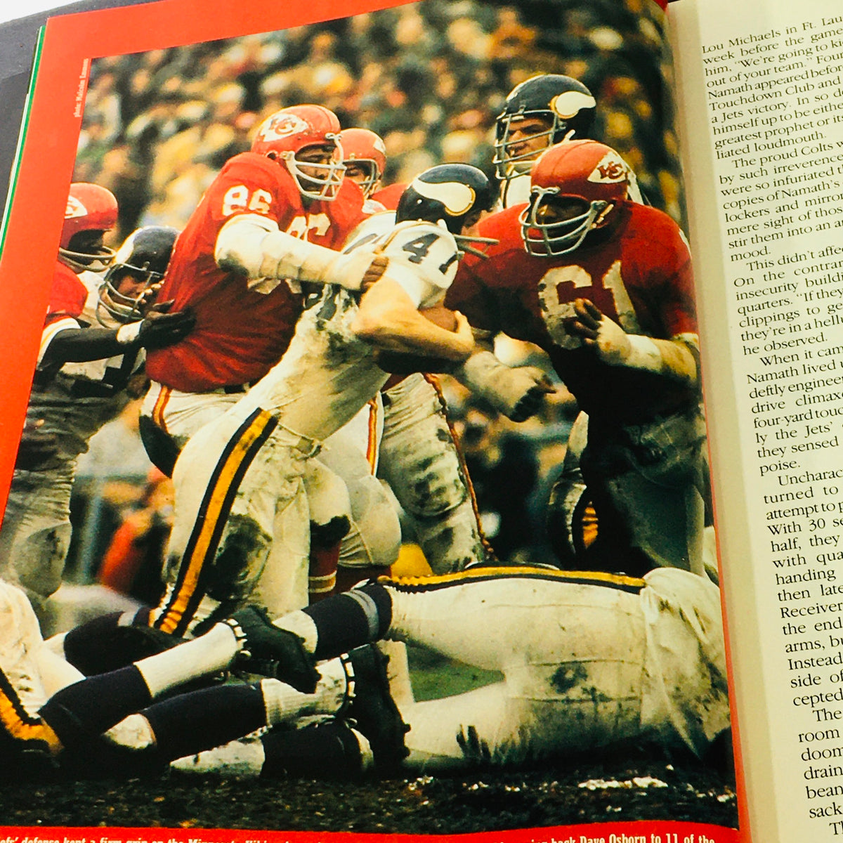 Historic football matchup image within the VTG 1984 Official Super Bowl XIX Scenic Guide to San Francisco Bay, depicting intense action during a game.