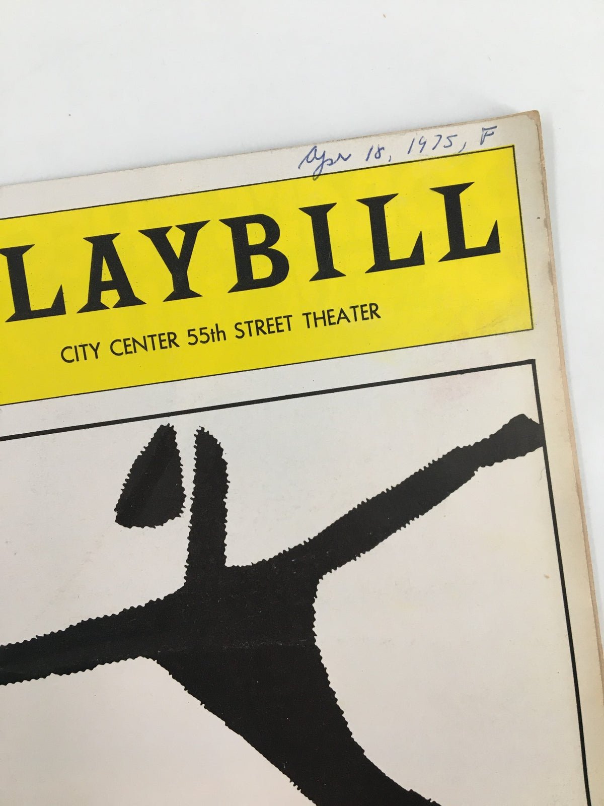 Close-up view of the 1975 Playbill for Alvin Ailey City Center Dance Theater, showcasing artistic silhouette and title details.