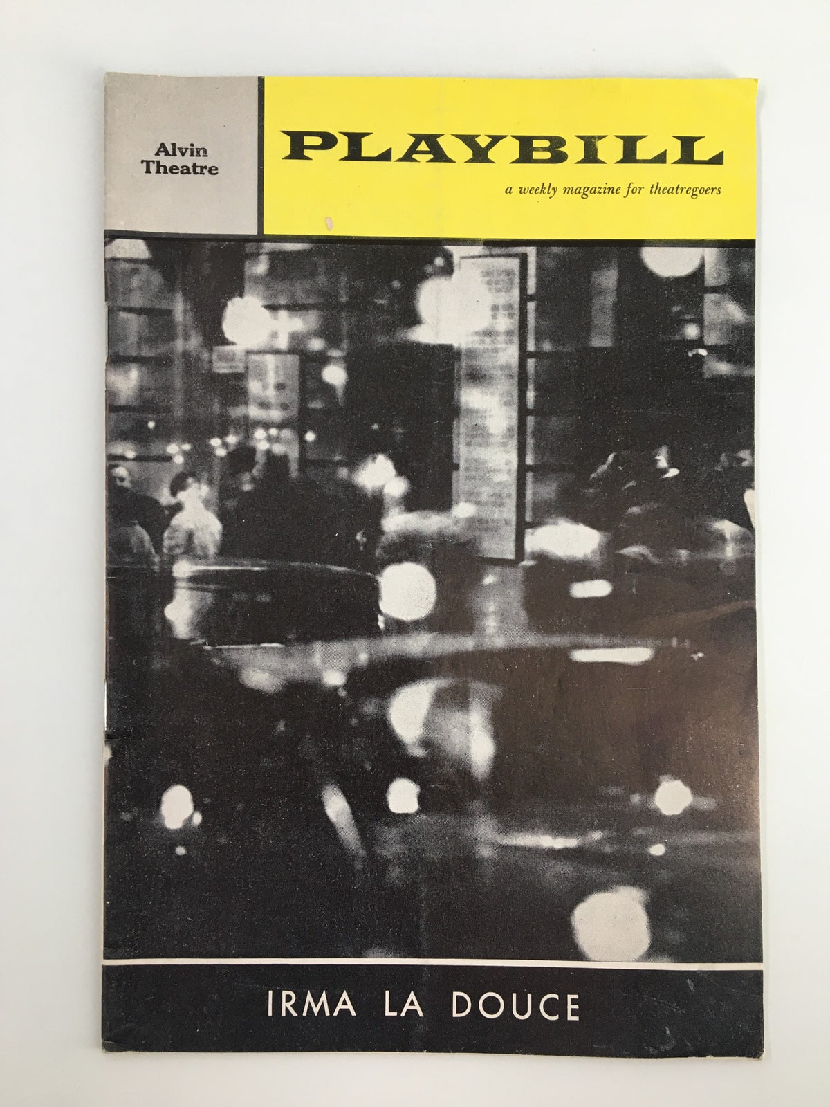 1961 Playbill for Irma La Douce from the Alvin Theatre featuring a vintage design with a black and white photograph.