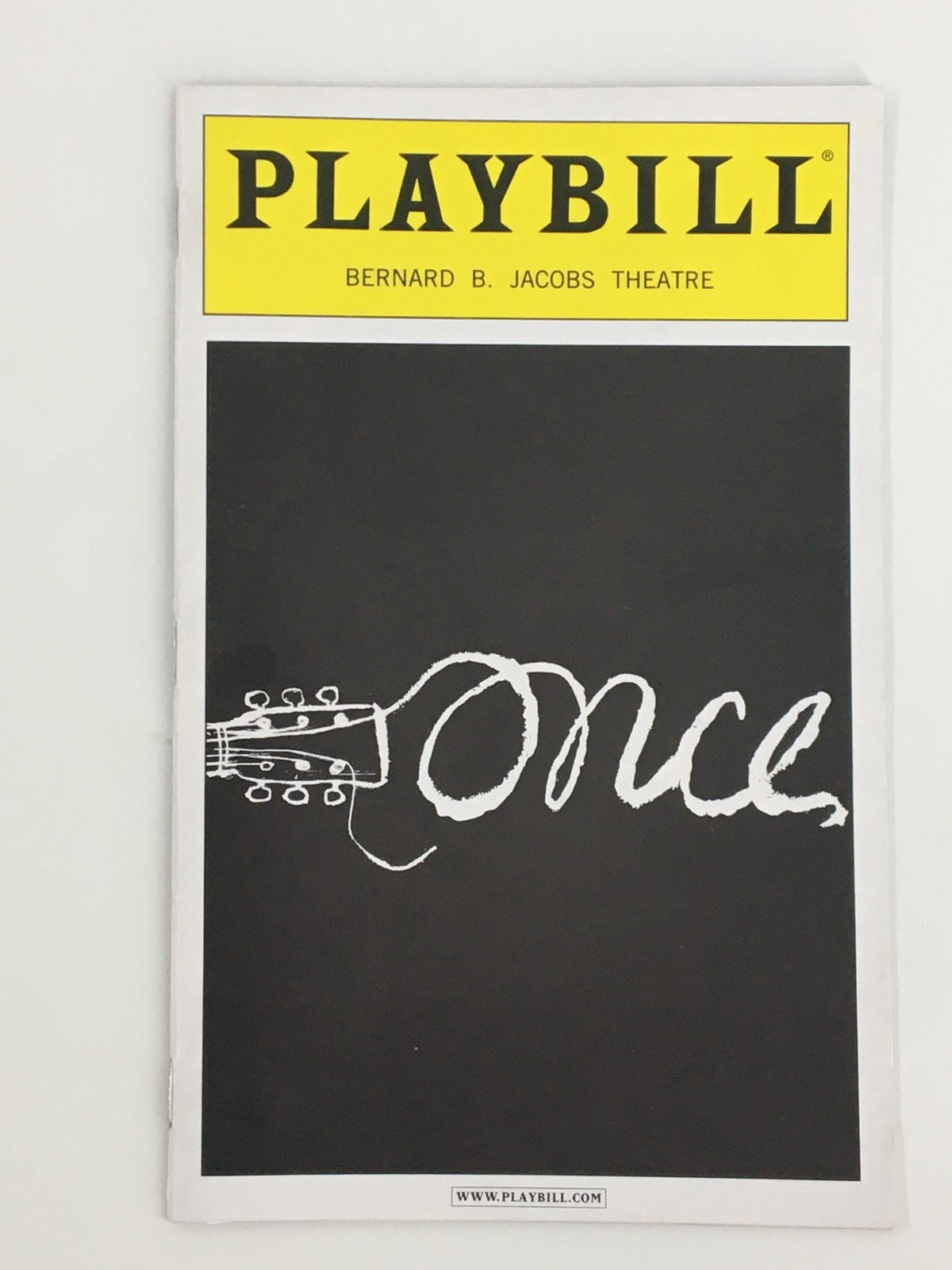 Playbill for the 2013 production of Once at Bernard B. Jacobs Theatre, showcasing a guitar illustration on the cover.