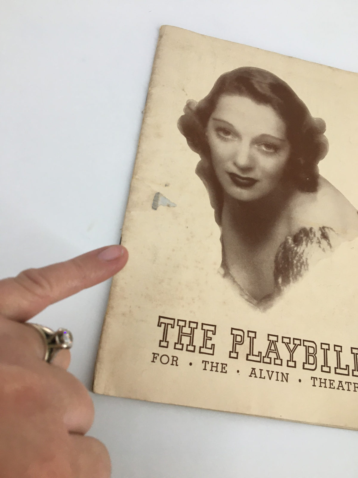 Close-up of the 1941 Playbill for the Alvin Theatre depicting Gertrude Lawrence in Lady in the Dark, highlighting the playbill's condition and iconic retro style.