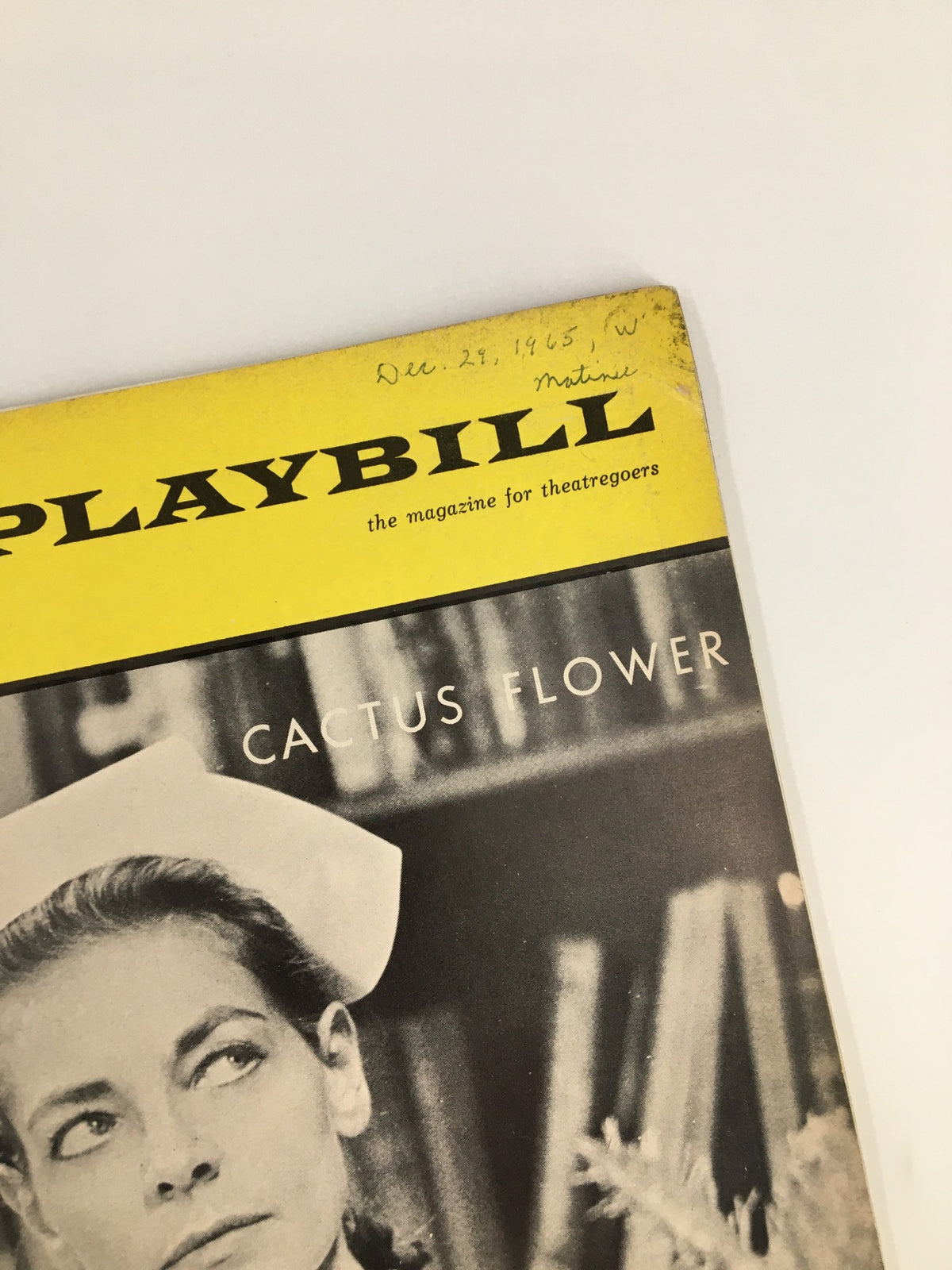 Close-up of the 1965 Playbill Royale Theatre cover for Cactus Flower, highlighting the date handwritten on it.