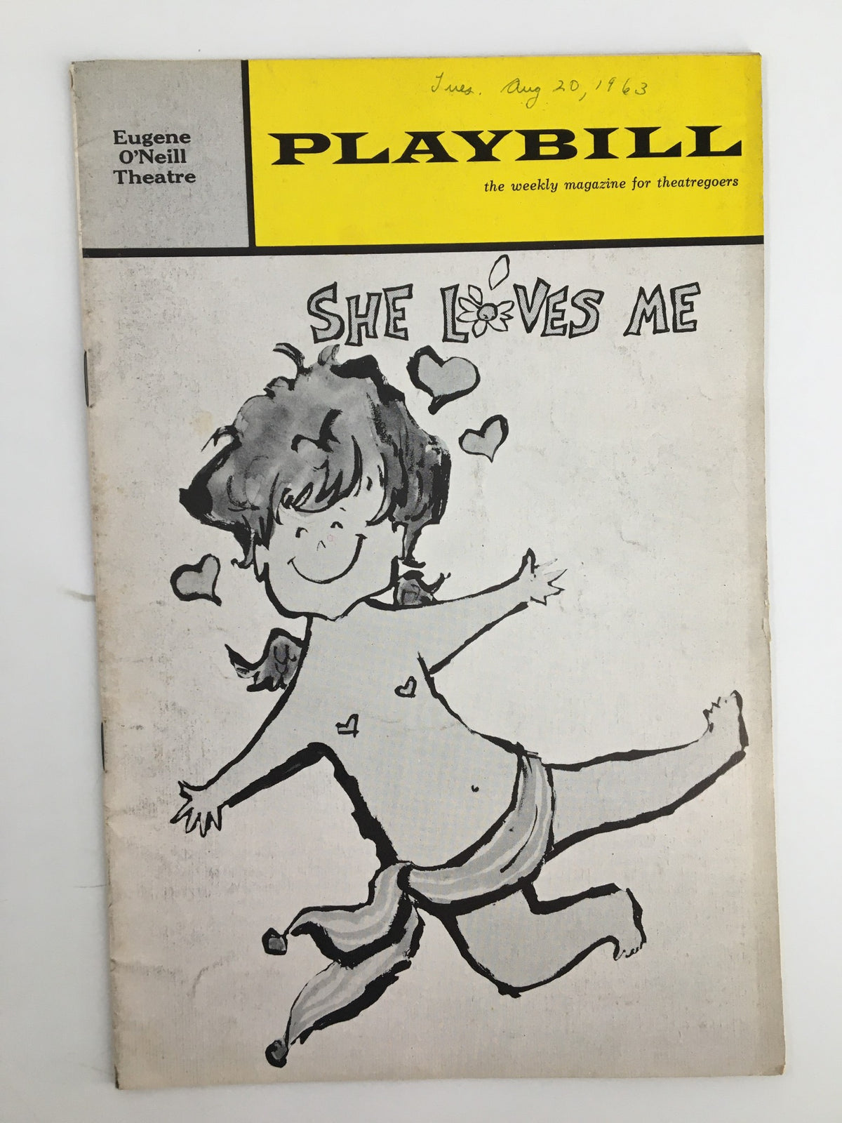 Cover of the 1963 Playbill featuring the Broadway musical 'She Loves Me' at Eugene O'Neill Theatre, illustrated by a whimsical drawing of a joyful character with hearts.