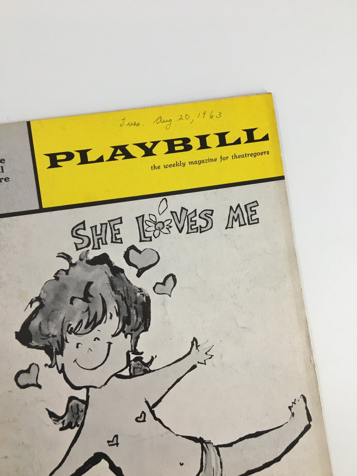 Close-up of the top section of the 1963 Playbill for 'She Loves Me' at Eugene O'Neill Theatre, showcasing the playful illustration and the date August 20, 1963.
