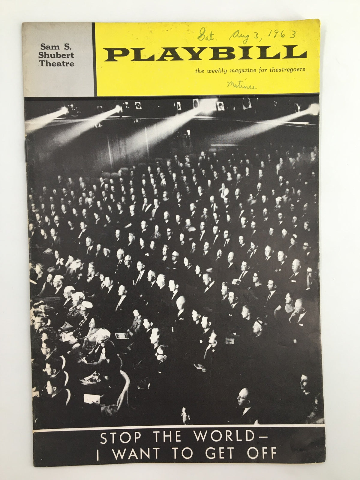 1963 Playbill for Stop The World - I Want To Get Off, featuring a vintage black and white photo of an audience at the Sam S. Shubert Theatre.